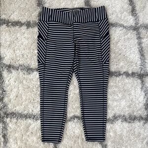 Athleta Striped Leggings in Navy and White with Hidden zipper side pockets.